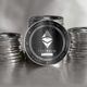 Ethereum-ETH-silver-coins-son-a-gray-background.