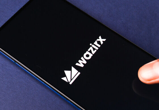 The WazirX logo on a phone