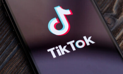 An image of the TikTok logo on a phone screen