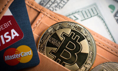 Debit cards, Bitcoin and dollar bills